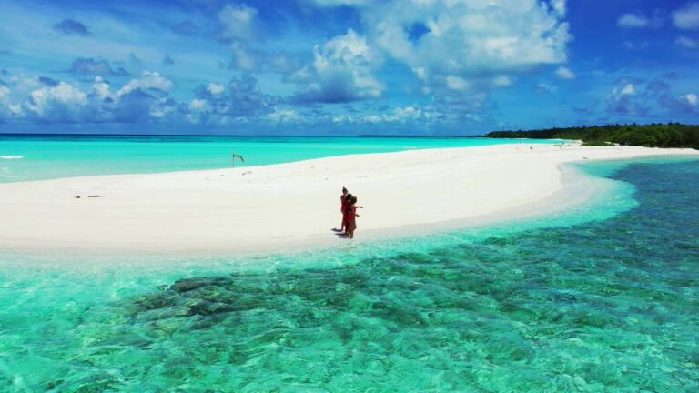 women walking on fulhadhoo beach